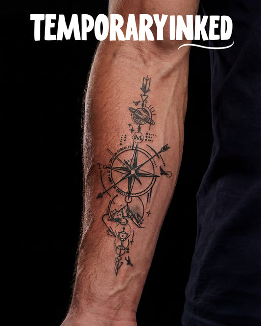 Tattoo of a compass design on a person's arm with 'TEMPORARY INKED' text above.